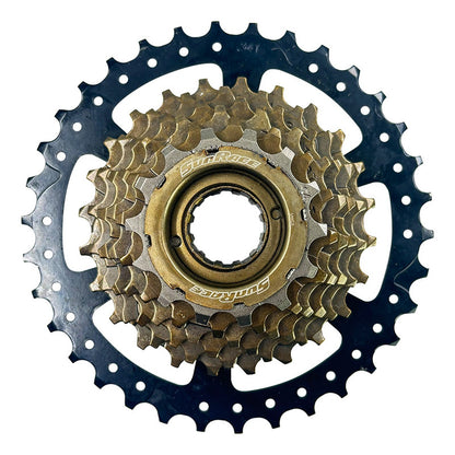 Pacha De Rosca 7 Vel. Sunrace M300 14-34 Mtb + Cadena Gw S51 Negro Bronce 14 34